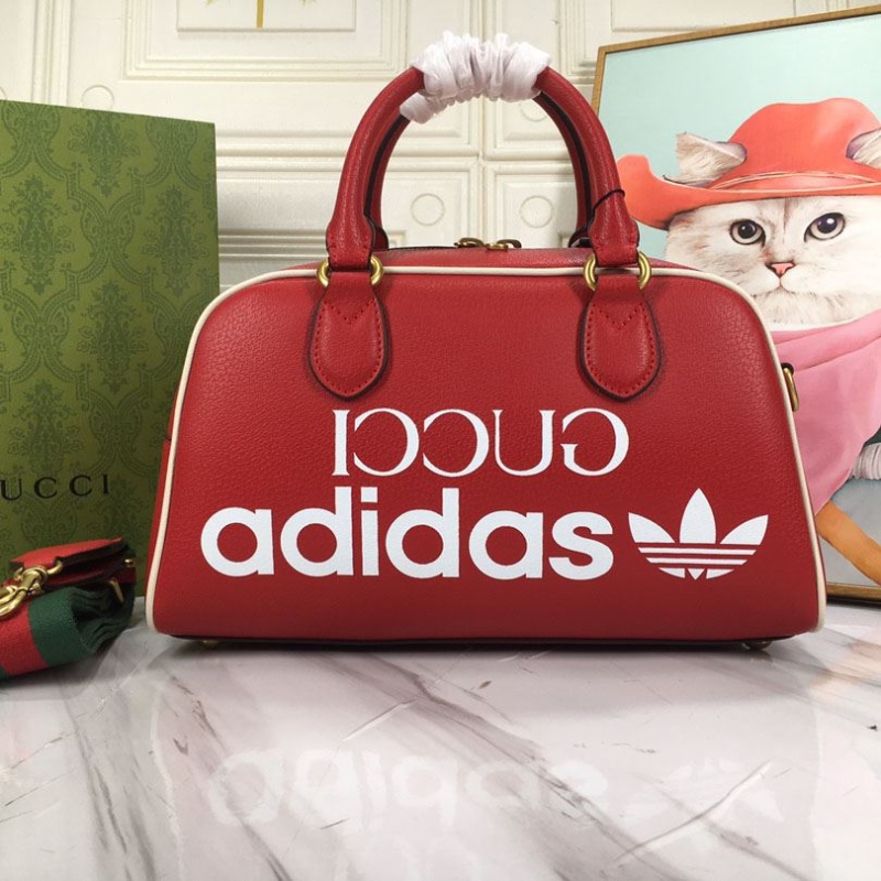 G*u*i top handle bags